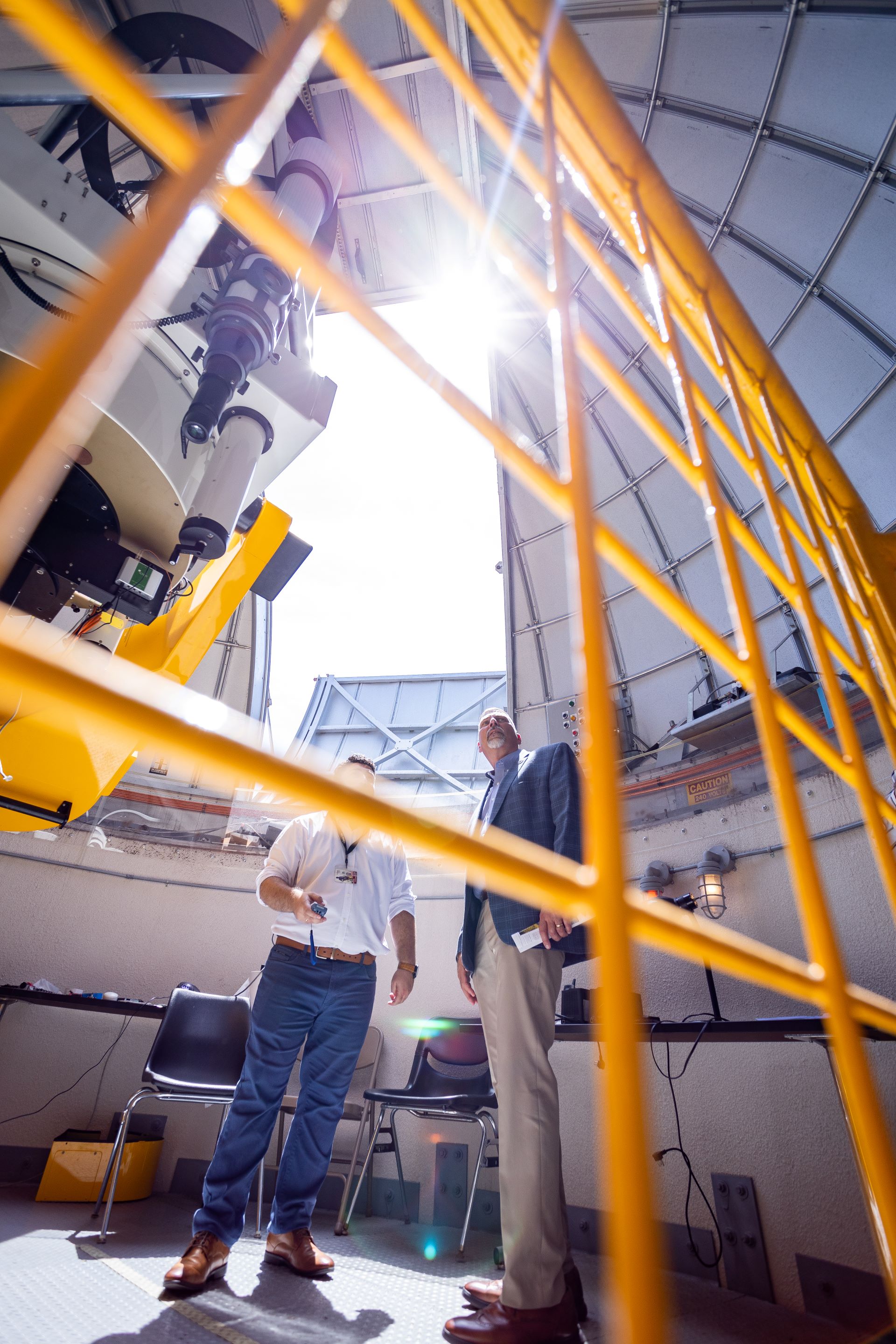 Upward view from the staircase in a hallway